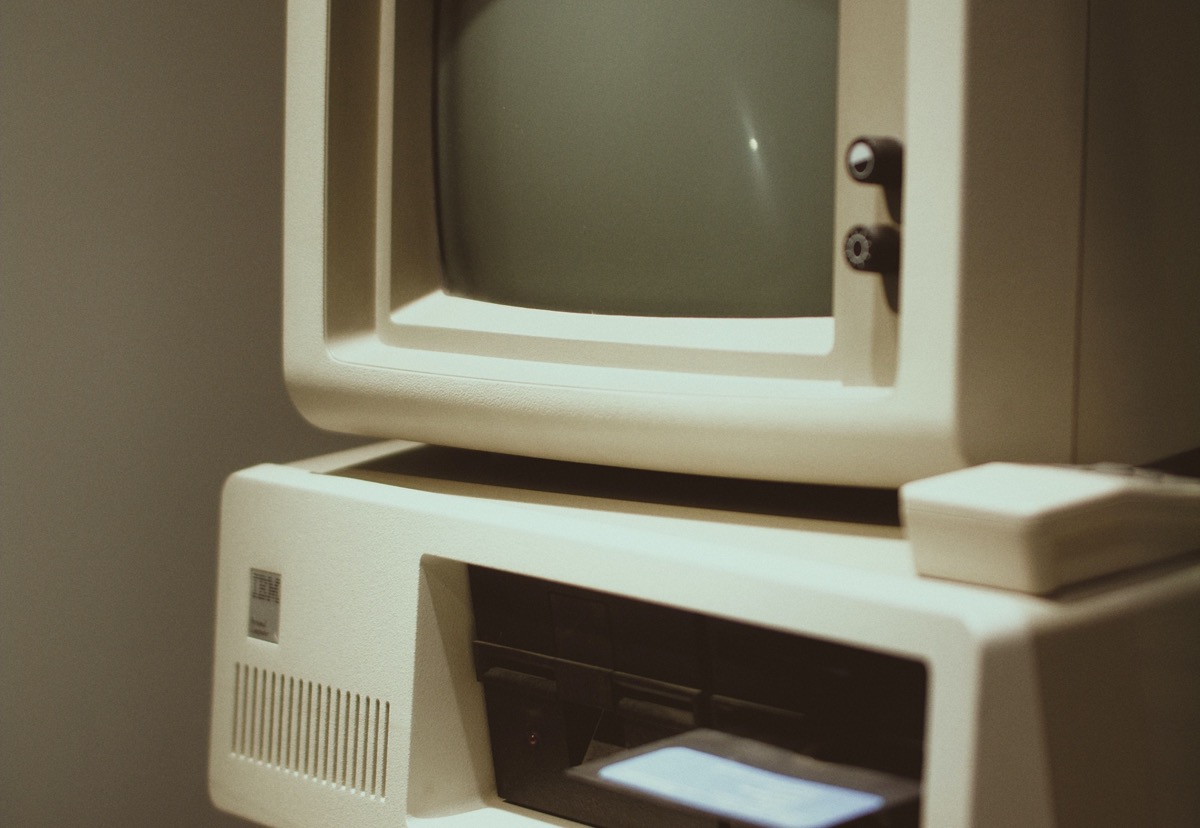 A vintage computer and disk drive representing an ageing business application