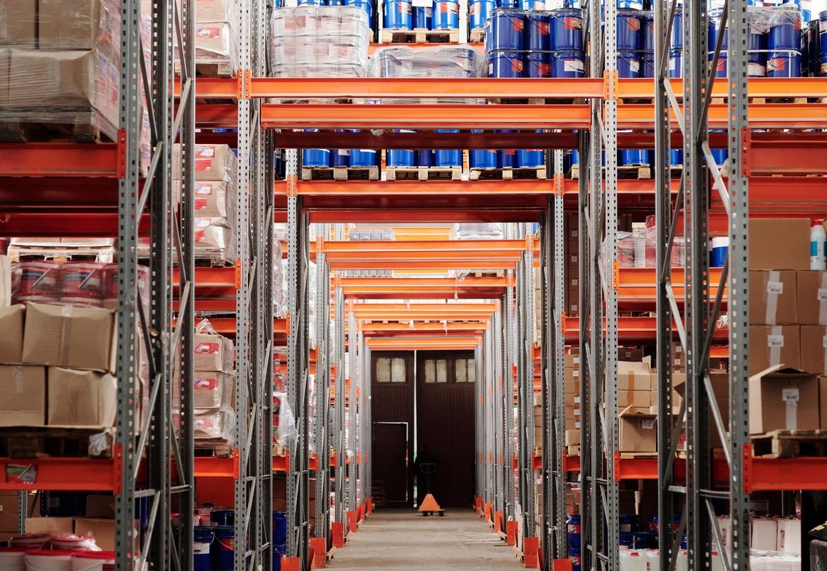 An organised warehouse aisle divided into clearly separated storage bays
